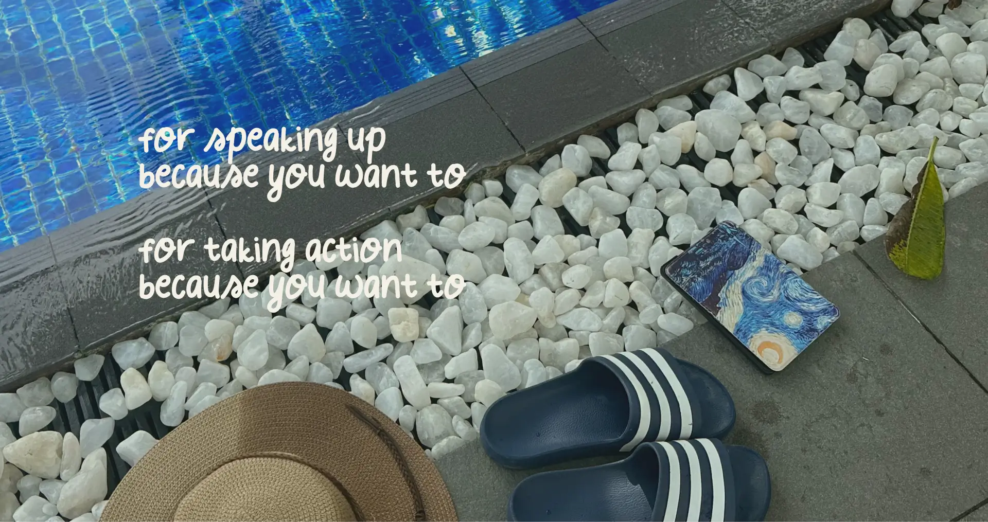 A hat, slippers, and an e-reader by the pool.